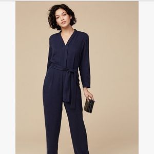 flattering navy jumpsuit with waist tie.